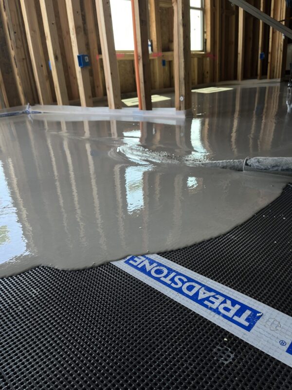 Treadstone Elite sound mat installation underneath Sitemix leveling underlayment