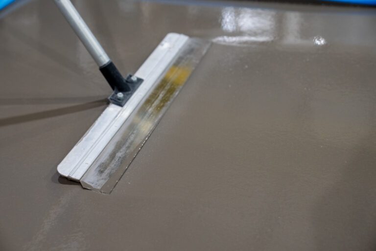 Gauge rake pulling a uniform pass across fresh material.